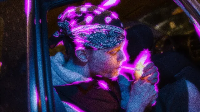 LUCK7 lighting a cigarette in neon light